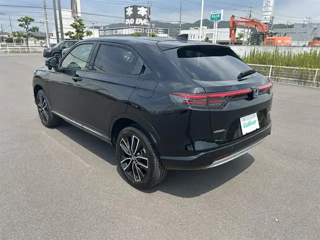 ホンダ ヴェゼル ハイブリッド e:HEV Z 岡山県 2025(令7)年 0.1千km クリスタルブラックパール 登録時走行距離4km/純正9インチナビ/フルセグTV(AM.FM.TV.BT)/バックカメラ/ETC2.0/ブラインドスポットモニター/シートヒーター/ステアリングヒーター/クリアランスソナー/衝突軽減ブレーキ/レーダークルーズコントロール/レーンキープアシスト/オートライト/アイドリングストップ/電動リアゲート/18インチ純正AW