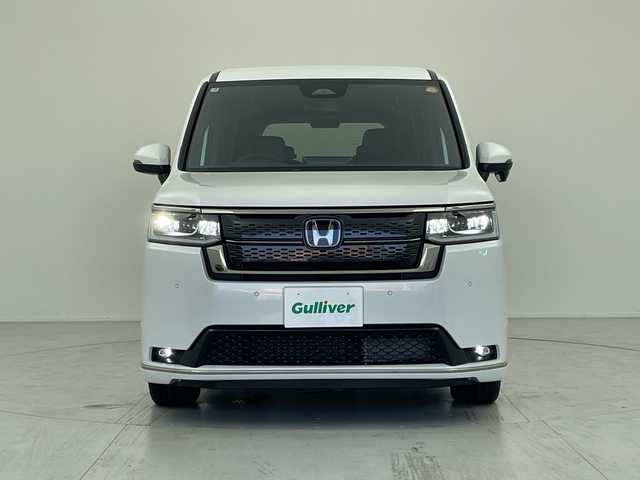 ホンダ ステップワゴン スパーダ eHEV 愛知県 2025(令7)年 0.1千km プラチナホワイトパール 登録済未使用車/純正１１インチナビ/・フルセグ/・Ｂｌｕｅｔｏｏｔｈ/・ＤＶＤ/・ＣＤ/・FM/AM/・AppleCarPlay/・AndroidAuto/両側パワースライドドア/バックカメラ/アダプティブクルーズコントロール/ホンダセンシング/衝突軽減ブレーキ/前後誤発進抑制機能/車線逸脱抑制機能/トラフィックジャムアシスト/車線維持支援システム/先行車発進お知らせ機能/オートマチックハイビーム/標識認識機能/コーナーセンサー/電動リアゲート/オットマン/パドルシフト/LEDヘッドライト/カーテンエアバック