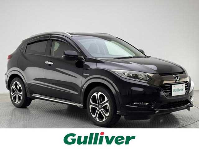 ホンダ ヴェゼル ハイブリッド 兵庫県 2016(平28)年 10.3万km クリスタルブラックパール 社外7インチナビ（CD/DVD・FM/AM・BT・フルセグ）/ホンダセンシング/ETC/HDMI/プッシュスタート/スマートキー2本/レザーシート/パワーシート（D/N席）/シートヒーター（D/N席）/シートメモリー（D席）/純正AW17インチ/純正フロアマット/追従式クルーズコントロール/パドルシフト/ルーフレール/電動パーキング/オートブレーキホールド/LEDヘッドランプ/フォグランプ/オートライト/電動格納ミラー/ウインカーミラー/ドアバイザー/自動防眩ミラー/チャイルドシート対応