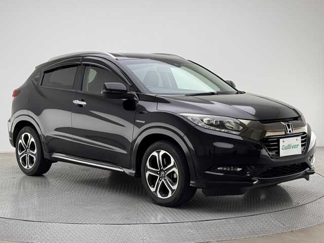 ホンダ ヴェゼル ハイブリッド 兵庫県 2016(平28)年 10.3万km クリスタルブラックパール 社外7インチナビ（CD/DVD・FM/AM・BT・フルセグ）/ホンダセンシング/ETC/HDMI/プッシュスタート/スマートキー2本/レザーシート/パワーシート（D/N席）/シートヒーター（D/N席）/シートメモリー（D席）/純正AW17インチ/純正フロアマット/追従式クルーズコントロール/パドルシフト/ルーフレール/電動パーキング/オートブレーキホールド/LEDヘッドランプ/フォグランプ/オートライト/電動格納ミラー/ウインカーミラー/ドアバイザー/自動防眩ミラー/チャイルドシート対応