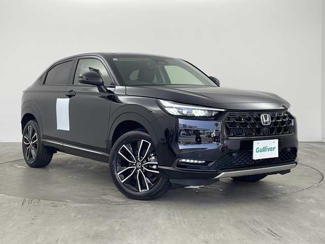 ホンダ ヴェゼル ハイブリッド e:HEV Z 兵庫県 2025(令7)年 0.1千km クリスタルブラックパール ・純正ディスプレイオーディオ/・AM/FM/BT/USB/Apple CarPlay/Android Auto/・フルセグTV/・ホンダセンシング/・衝突軽減ブレーキ/・先行車発進お知らせ/・路外逸脱抑制システム/・レーンキープアシスト/・ブラインドスポットモニター/・標識認識機能/・アダプティブドライビングビーム/・デイタイムランニングライト/・LEDオートライト/・レーダークルーズコントロール/・クリアランスソナー/・前後コーナーセンサー/・横滑り防止装置/・バックカメラ/・電動パーキングブレーキ/・ブレーキホールド/・置くだけ充電/・パワーバックドア/・ハンズフリー開閉パワーテールゲート/・前席シートヒーター/・ステアリングヒーター/・革巻きステアリング/・ステアリングリモコン/・左右独立エアコン/・ビルトインETC2.0/・スマートキー/・スペアキー/・プッシュスタート
