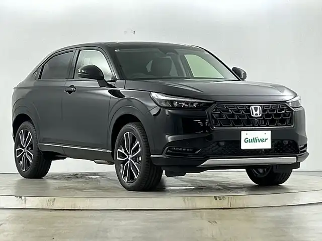 ホンダ ヴェゼル ハイブリッド e:HEV Z 愛知県 2025(令7)年 0.1千km クリスタルブラックパール Honda CONNECT9インチディスプレー/・インターナビ/・地デジTV/・リアワイドカメラ/・Bluetooth/・ステアリングスイッチ/ホンダセンシング（安全運転支援）/・衝突軽減ブレーキ/・オートハイビーム/・パーキングセンサー/・レーダークルーズコントロール/純正5本スポークアルミホイール/雨滴検知フロントワイパー/ブラックプライムスムーズ（合皮）ファブリックコンビシート/・前席シートヒーター/ハンズフリーパワーバックドア/ETC2.0車載器/ワイヤレス充電器/フロントグリル　ベルリナブラック(41250円)