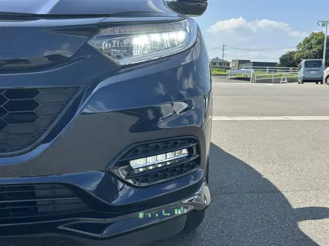 ホンダ ヴェゼル ハイブリッド RS ホンダセンシング 佐賀県 2019(平31)年 5.7万km ミッドナイトブルービームM /純正DOP8インチナビ≪VXM-197VFEi≫//バックカメラ//フルセグTV/DVD/Bluetooth/USB/HDMI//AppleＣａｒＰｌａｙ//ＲＳ専用ハーフレザーシート//シートヒーター//ＲＳ専用アルミホイール18インチ//電動パーキングブレーキ//オートブレーキホールド//スマートキー//スペアキー//ＥＴＣ//純正ドライブレコーダー//リアドライブレコーダー//ホンダセンシング//ＣＭＢＳ警報//ＡＣＣ≪アダプティブオートクルーズコントロール≫//先行車発進お知らせ//路外逸脱抑制システム//レーンキープアシストシステム//リアクティブフォースペダル//標識認識機能