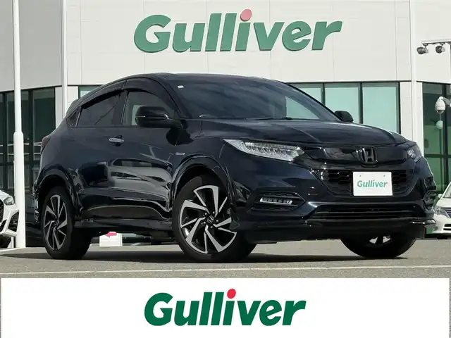 ホンダ ヴェゼル ハイブリッド RS ホンダセンシング 佐賀県 2019(平31)年 5.7万km ミッドナイトブルービームM 純正DOP8インチナビ≪VXM-197VFEi≫/バックカメラ/・フルセグTV/DVD/Bluetooth/USB/HDMI//AppleＣａｒＰｌａｙ/ＲＳ専用ハーフレザーシート/シートヒーター/ＲＳ専用アルミホイール18インチ/電動パーキングブレーキ/・オートブレーキホールド/スマートキー/スペアキー/ＥＴＣ/純正ドライブレコーダー/リアドライブレコーダー/ホンダセンシング/・ＣＭＢＳ警報/・ＡＣＣ≪アダプティブオートクルーズコントロール≫/・先行車発進お知らせ/・路外逸脱抑制システム/・レーンキープアシストシステム/・リアクティブフォースペダル/・標識認識機能