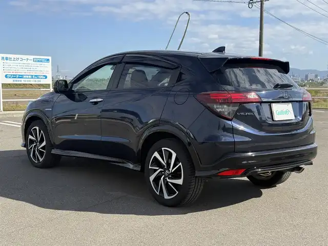 ホンダ ヴェゼル ハイブリッド RS ホンダセンシング 佐賀県 2019(平31)年 5.7万km ミッドナイトブルービームM 純正DOP8インチナビ≪VXM-197VFEi≫/バックカメラ/・フルセグTV/DVD/Bluetooth/USB/HDMI//AppleＣａｒＰｌａｙ/ＲＳ専用ハーフレザーシート/シートヒーター/ＲＳ専用アルミホイール18インチ/電動パーキングブレーキ/・オートブレーキホールド/スマートキー/スペアキー/ＥＴＣ/純正ドライブレコーダー/リアドライブレコーダー/ホンダセンシング/・ＣＭＢＳ警報/・ＡＣＣ≪アダプティブオートクルーズコントロール≫/・先行車発進お知らせ/・路外逸脱抑制システム/・レーンキープアシストシステム/・リアクティブフォースペダル/・標識認識機能