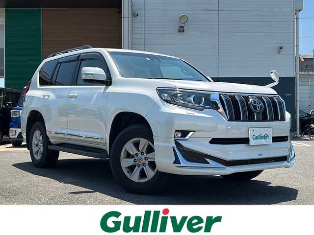 トヨタ ランドクルーザー プラド TX 佐賀県 2019(平31)年 6.7万km ホワイトパールクリスタルシャイン 純正ナビ/Bluetooth/CD/DVD/地デジテレビ/ワンオーナー/サンルーフ/追従機能付きクルーズコントロール/LEDオートライト/オートマチックハイビーム/オートエアコン/レーンキープアシスト/衝突軽減システム/クリアランスソナー/コーナーセンサー前後/エアバッグWサイド、カーテンエアバッグ/ステアリングスイッチ/クリアランスソナー/電格ウィンカーミラー/スマートキー/取扱説明書/保証書/記録簿H31.R1.4.6年