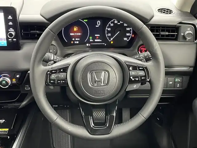 ホンダ ヴェゼル ハイブリッド e:HEV Z 岡山県 2025(令7)年 0.1千km クリスタルブラックパール 純正ディスプレイオーディオ　/【BT/フルセグ/CarPlay】/シートヒーター　/レーダークルーズコントロール　/ＬＥＤヘッドライト　/ＥＴＣ2.0/バックカメラ　/ワイヤレス充電　/ブラインドスポットモニター　/ステアリングヒーター　/電動リアゲート/オートハイビーム/コーナーセンサー/アイドリングストップ/踏み間違い防止/ステアリングスイッチ/スペアキー×1/オートエアコン