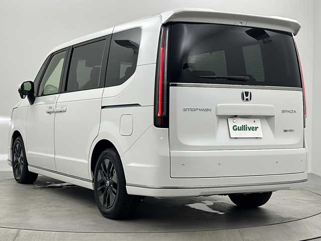 ホンダ ステップワゴン スパーダ eHEV 大阪府 2025(令7)年 0.1千km プラチナホワイトパール 純正11.4インチナビHonda CONNECTナビ /・フルセグTV/・Bluetooth/・CD/DVD/・USB接続/・SDミュージックサーバー/Honnda SENSING/・衝突軽減ブレーキ/・誤発進抑制機能/・歩行者事故低減ステアリング/・路外逸脱抑制機能/・アダプティブクルーズコントロール/・車線維持支援システム/・トラフィックジャムアシスト/・先行車発進お知らせ機能/・標識認識機能/・オートハイビーム/・アダプティブドライビングビーム/・パーキングセンサーシステム/・急アクセル抑制機能/・ブラインドスポットインフォメーション/パワーバックドア/両側パワースライドドア/バックカメラ/2列目オットマン/シートヒーター/LEDヘッドライト/ステアリングスイッチ