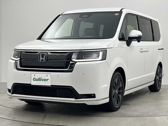 ホンダ ステップワゴン スパーダ eHEV 大阪府 2025(令7)年 0.1千km プラチナホワイトパール 純正11.4インチナビHonda CONNECTナビ /・フルセグTV/・Bluetooth/・CD/DVD/・USB接続/・SDミュージックサーバー/Honnda SENSING/・衝突軽減ブレーキ/・誤発進抑制機能/・歩行者事故低減ステアリング/・路外逸脱抑制機能/・アダプティブクルーズコントロール/・車線維持支援システム/・トラフィックジャムアシスト/・先行車発進お知らせ機能/・標識認識機能/・オートハイビーム/・アダプティブドライビングビーム/・パーキングセンサーシステム/・急アクセル抑制機能/・ブラインドスポットインフォメーション/パワーバックドア/両側パワースライドドア/バックカメラ/2列目オットマン/シートヒーター/LEDヘッドライト/ステアリングスイッチ