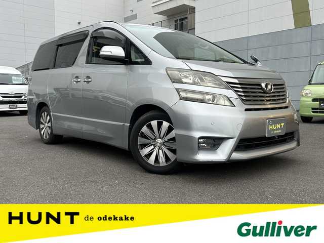 トヨタ ヴェルファイア 2．4Z 千葉県 2009(平21)年 9.4万km グレーM 両側パワースライドドア/フリップダウンモニター/純正７インチＨＤＤナビ/ワンセグＴＶ/ＥＴＣ/オットマンシート/社外１７インチアルミホイール/プッシュスタート/スマートキー