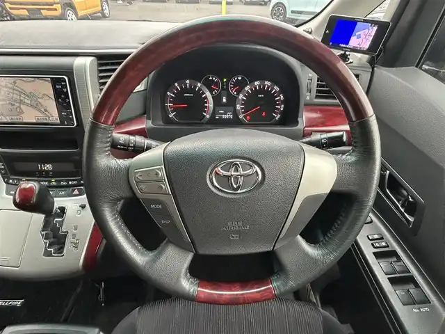 トヨタ ヴェルファイア 2．4Z 千葉県 2009(平21)年 9.4万km グレーM 両側パワースライドドア/フリップダウンモニター/純正７インチＨＤＤナビ/ワンセグＴＶ/ＥＴＣ/オットマンシート/社外１７インチアルミホイール/プッシュスタート/スマートキー