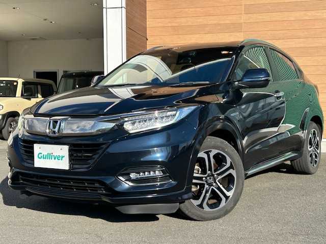 ホンダ ヴェゼル ハイブリッド Z ホンダセンシング 静岡県 2018(平30)年 8.9万km ミッドナイトブルービームM 純正8インチナビ[VXM-187VFEi]/（フルセグTV/ＣＤ/ＤＶＤ/Ｂｌｕｅｔｏｏｔｈ/AppleCarPlay）/ホンダセンシング/・衝突被害軽減ブレーキ/・車線逸脱警報機能/・アダプティブクルーズコントロール/バックカメラ/純正前後ドライブレコーダー/ビルトインＥＴＣ/ハーフレザーシート/シートヒーター/ステアリングスイッチ/LEDヘッドライト/純正アルミホイール/スマートキー×２/保証書/取扱説明書