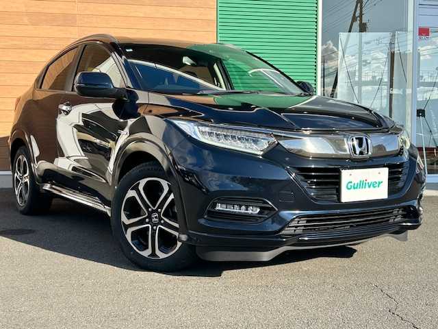 ホンダ ヴェゼル ハイブリッド Z ホンダセンシング 静岡県 2018(平30)年 8.9万km ミッドナイトブルービームM 純正8インチナビ[VXM-187VFEi]/（フルセグTV/ＣＤ/ＤＶＤ/Ｂｌｕｅｔｏｏｔｈ/AppleCarPlay）/ホンダセンシング/・衝突被害軽減ブレーキ/・車線逸脱警報機能/・アダプティブクルーズコントロール/バックカメラ/純正前後ドライブレコーダー/ビルトインＥＴＣ/ハーフレザーシート/シートヒーター/ステアリングスイッチ/LEDヘッドライト/純正アルミホイール/スマートキー×２/保証書/取扱説明書