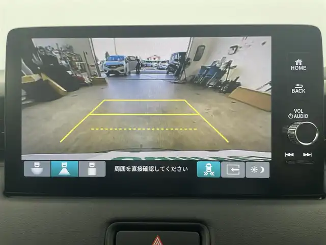 ホンダ ヴェゼル ハイブリッド e:HEV Z 富山県 2025(令7)年 0.1千km プラチナホワイトパール 純正9型ナビ（AM/FM/BT/USB/フルセグ）/バックカメラ/ETC/ハーフレザーシート/シートヒーター/ハンドルヒーター/ブラインドスポットモニター/オートホールド付電子パーキング/衝突被害軽減システム/レーダークルーズコントロール/レーンキープアシスト/コーナーセンサー/横滑り防止装置/アイドリングストップ/純正アルミホイール/オートLEDライト/フォグライト/置くだけ充電/革巻きステアリング/ステアリングスイッチ/スマートキー/スペアキー