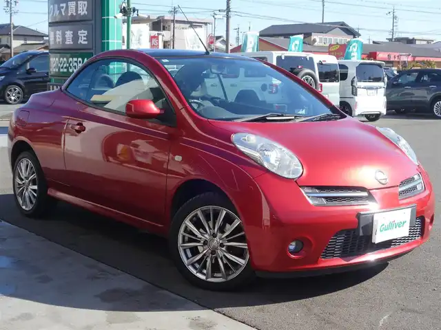 日産 マイクラ Ｃ＋Ｃ 静岡県 2007(平19)年 10.5万km ワインＭ マーチマイクラコンバーチブル/電動オープン/スタイリッシュガラスルーフ/自店管理ユーザー買取車両/車検令和9年5月まで/禁煙車/HIDヘッドライト/純正CDチューナー/ETC/革巻きステアリング/フロントフォグランプ/社外16インチアルミ/イモビライザー/保証書