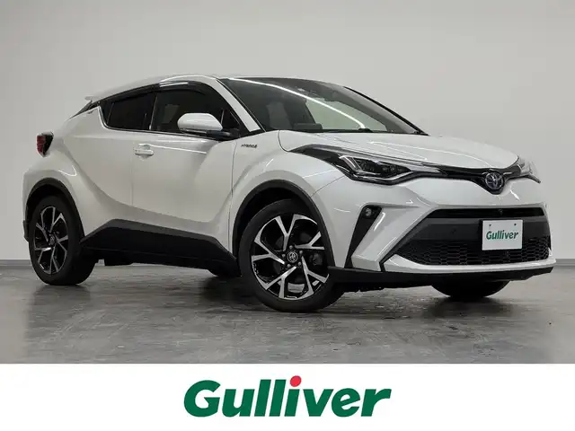 トヨタ Ｃ－ＨＲ G 三重県 2020(令2)年 3万km ホワイトパールクリスタルシャイン ハイブリッド/FF/フロアCVT/純正 8インチディスプレイオーディオ＋ナビ/（AM/FM/USB/Bluetooth/Miracast/CarPlay/AndroidAuto）/【OP】パノラミックビューモニター/ドライブレコーダー 前後/ビルトイン ETC/Toyota Safety Sense/・プリクラッシュセーフティ［PCS］/・レーンディパーチャーアラート［LDA］（ステアリング制御付）/・オートハイビーム［AHB］/・レーダークルーズ（全車速追従機能付）/・ブラインドスポットモニター［BSM］/・インテリジェント クリアランスソナー/・リヤクロストラフィックオートブレーキ［パーキングサポートブレーキ（静止物・後方接近車両）］/装備/・【OP】寒冷地仕様/　・ウインドシールドデアイサー、リヤフォグランプ、PTCヒーター、ヒーターリヤダクトなど/・ハーフレザーシート/・シートヒーター（D/N）/・左右独立オートエアコン/・オートライト/・LEDヘッドライト/・LEDフロント&リヤフォグランプ/・雨滴感応式フロントワイパー/・純正18inAW/・保/取/ナビ取/マルチ取/・予備スマートキーx1/・純正リモコンエンジンスターターx1