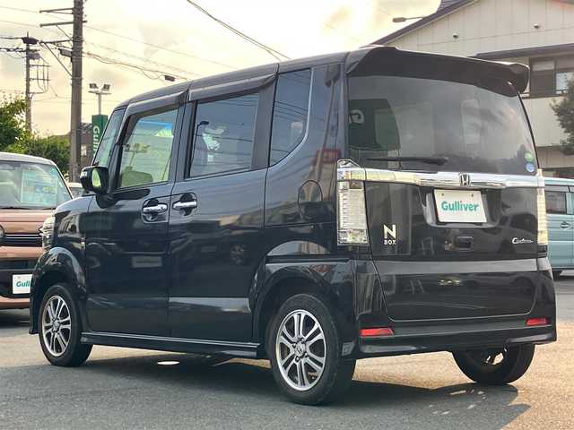 ホンダ Ｎ ＢＯＸ カスタム G SSパッケージ 静岡県 2015(平27)年 6.5万km プレミアムゴールドパープルパール エンジンスタートボタン/パワーステアリング/パワーウィンドウ/保証書/取扱説明書/アイドリングストップ/スマートキー/スペアキー１本/オートエアコン/ETC/SDナビ（CD/ワンセグ）/ベンチシート/フロアマット/両側パワースライドドア/純正アルミホイール/ABS/横滑り防止装置/盗難防止装置/オートライト/W+サイドエアバック/衝突軽減システム/カーテンエアバック