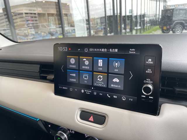 ホンダ ヴェゼル ハイブリッド e:HEV Z PLaYパッケージ 愛知県 2025(令7)年 0.1千km プレミアムサンライトホワイトパール 登録済未使用車/純正9型ディズプレイオーディオナビ/衝突軽減システム/レーダークルーズコントロール/バックカメラ/レーンキープアシスト/シートヒーター/ステアリングヒーター/ブラインドスポットモニター/電動リアゲート/SOSコール/ワイヤレス充電器/パドルシフト/LEDヘッドライト/ハーフレザーシート/ステアリングスイッチ/スマートキー/プッシュスタート/コーナーセンサー/純正アルミホイール