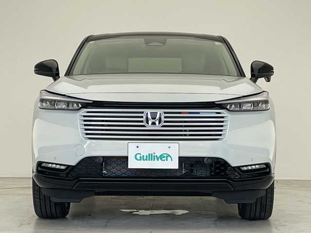 ホンダ ヴェゼル ハイブリッド e:HEV Z PLaYパッケージ 愛知県 2025(令7)年 0.1千km プレミアムサンライトホワイトパール 登録済未使用車/純正9型ディズプレイオーディオナビ/衝突軽減システム/レーダークルーズコントロール/バックカメラ/レーンキープアシスト/シートヒーター/ステアリングヒーター/ブラインドスポットモニター/電動リアゲート/SOSコール/ワイヤレス充電器/パドルシフト/LEDヘッドライト/ハーフレザーシート/ステアリングスイッチ/スマートキー/プッシュスタート/コーナーセンサー/純正アルミホイール