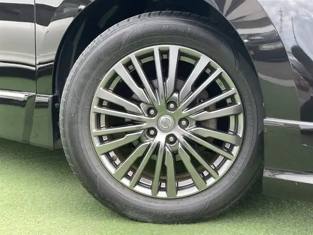 日産 エルグランド 250HWS アーバンクロム 香川県 2017(平29)年 5.7万km ファントムブラック 純正8インチナビ/フリップダウンモニター/両側パワースライドドア/ハーフレザーシート/ウッドコンビステアリング/ステアリングリモコン/レザー調シートカバー/LEDライト/フォグライト/スマートキー/プッシュスタート