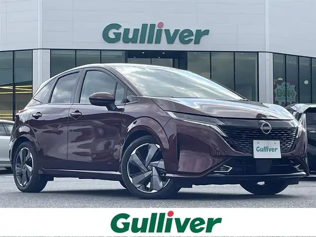 日産 オーラ G レザーエディション 島根県 2024(令6)年 2.4万km バーガンディー 登録時走行距離　23306km/純正ナビ(Bluetooth/AM/FM/USB/HDMI)/フルセグテレビ/BOSEサウンド/全周囲カメラ/プロパイロット/シートヒーター（DN席）/ステアリングヒーター/ステアリングスイッチ/ブラインドスポットモニター/置くだけモバイル充電/オートライト/オートハイビーム/コーナーセンサー/速度標識表示/エマージェンシーブレーキ/レーンキープアシスト/ドライブレコーダー/ETC2.０/純正アルミ１７インチ