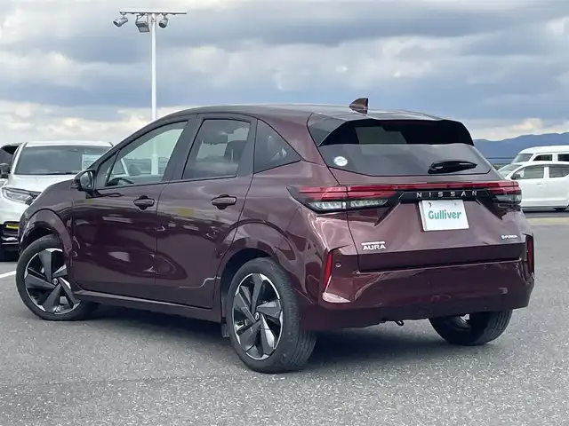 日産 オーラ G レザーエディション 島根県 2024(令6)年 2.4万km バーガンディー 登録時走行距離　23306km/純正ナビ(Bluetooth/AM/FM/USB/HDMI)/フルセグテレビ/BOSEサウンド/全周囲カメラ/プロパイロット/シートヒーター（DN席）/ステアリングヒーター/ステアリングスイッチ/ブラインドスポットモニター/置くだけモバイル充電/オートライト/オートハイビーム/コーナーセンサー/速度標識表示/エマージェンシーブレーキ/レーンキープアシスト/ドライブレコーダー/ETC2.０/純正アルミ１７インチ
