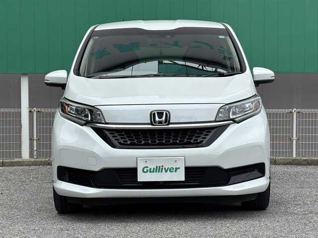 ホンダ フリード G ホンダセンシング 千葉県 2021(令3)年 2.4万km プラチナホワイトパール ワンオーナー/純正９インチメモリナビ/　（BT/DVD/CD/AM/FM)/ETC2.0/純正フリップダウン/純正前後ドラレコ/バックカメラ/ハーフレザー/前席シートヒーター/両側パワースライド/レーダークルーズコントロール/ホンダセンシング/LEDヘッドライト/スペアキー/取扱説明書/保証書