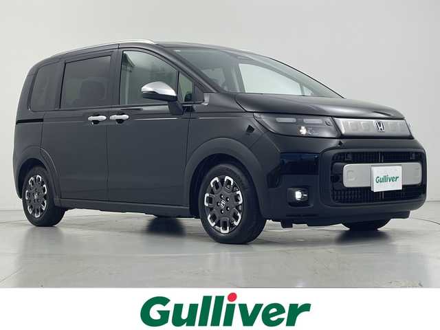 ホンダ フリード ハイブリット e:HEV クロスター 愛知県 2025(令7)年 0.1千km クリスタルブラックパール 登録済未使用車/ホンダセンシング/・衝突軽減ブレーキ/・誤発進抑制機能/・後方誤発進抑制機能/・近距離衝突軽減ブレーキ/・歩行者事故低減ステアリング/・路外逸脱抑制機能/・渋滞追従付アダプティブクルーズコントロール/・トラフィックアラート/・先行車発進のお知らせ/・オートハイビーム/・パーキングセンサー/純正9インチナビ/・AppleCarPlay/Android Auto/・Bluetooth/・フルセグTV/・FM/AM/バックカメラ/両側パワースライドドア/純正アルミホイール/ハーフレザーシート/シートヒーター/LEDヘッドライト/スマートキー/プッシュスタート