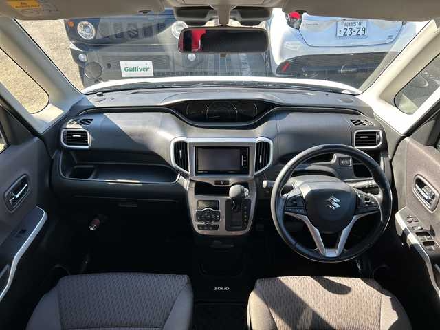 スズキ ソリオ HV MX 神奈川県 2017(平29)年 3.6万km ピュアホワイトP 社外SDナビ【CN-RE04WD】/Bluetooth・CD・DVD・SD・TV/両側パワースライドドア/クルーズコントロール/運転席シートヒーター/スペアキー1本/ETC/バックカメラ/純正フロアマット/LEDヘッドライト/オートライト/デュアルカメラブレーキサポート/誤発進抑制機能/車線逸脱警報機能/ふらつき警報機能/先行車発進お知らせ機能/エマージェンシーストップシグナル