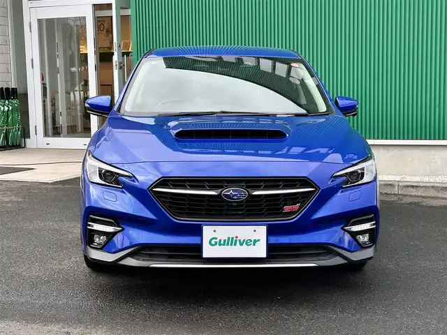 スバル レヴォーグ 1．8STIスポーツ EX 宮城県 2021(令3)年 3.4万km WRブルーパール アイサイトXテクノロジー/・渋滞時ハンズオフ/・渋滞時発進アシスト/・アクティブレーンチェンジアシスト/・ドライバー異常時対応/・カーブ前抑制機能/・料金所前速度制限/アイサイトコアテクノロジー/・プリクラッシュブレーキ/・AT誤発進抑制機能/・追従機能付きクルーズコントロール/・ツーリングアシスト/・車線逸脱抑制/アイサイトセイフティプラス/・運転支援テクノロジー/・視界拡張テクノロジー/4WD/STI12.3インチフル液晶メーター/純正11.6インチディスプレイナビ/・Bluetooth/・Apple CarPlay/Android Auto/・地デジTV/フロント/サイド/バックカメラ/サイドシルスポイラー/リアスポイラー/STIロゴ入り大型マフラーカッター/STIブラックツートンレザーシート/全席シートヒーター/左右独立温度調整フルオートエアコン/ハンズフリーバックドア/ステアリング連動フルLEDヘッドランプ/コムテック前後ドライブレコーダー/STIロゴ入ステアリング/STIロゴ入り高触感革巻きステアリング/STIロゴ入りフロアマット/保証書