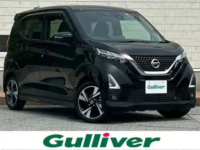 日産 デイズ HWS G ターボ プロパイロットED 滋賀県 2022(令4)年 3.7万km ブラック ガソリン（ハイブリッド）/2WD(FF)/CVT/９インチ純正ナビ【MM321D-L】/(FM/AM/CD/DVD/フルセグ)/アラウンドビューモニター/バックカメラ/前ドライブレコーダー/ETC/プロパイロット/・レーンキープアシスト	/・プリクラッシュブレーキアシスト	/・踏み間違い防止アシスト	/・ブレーキアシスト	/・フロント＆バックソナー/・標識検知機能	/電動格納ミラー/電動パーキング/ブレーキホールド/アイドリングストップ/ディスプレイ付自動防眩式ルームミラー/革巻きステアリング/ステアリングスイッチ/オートライト/LEDヘッドライト/フロントフォグ/ヘッドライトレベリング/フルオートエアコン/プッシュスタート/スマートキー/純正フロアマット/ドアバイザー/USB端子