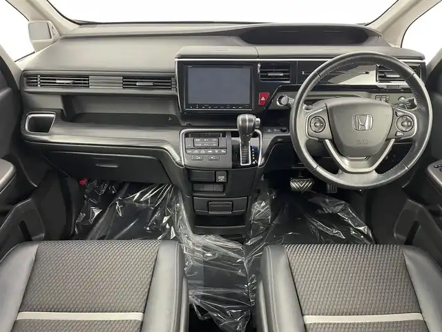 ホンダ ステップワゴン スパーダ クルスピセンシング 埼玉県 2016(平28)年 6.9万km プレミアムスパークルブラックパール 純正9型ナビ　Ｂｌｕｅｔｏｏｔｈ　バックカメラ　純正１１型後席モニター　両側パワースライドドア　シートヒーター　レーダークルーズコントロール　ハーフレザーシート　ビルトインＥＴＣ　レーンアシスト