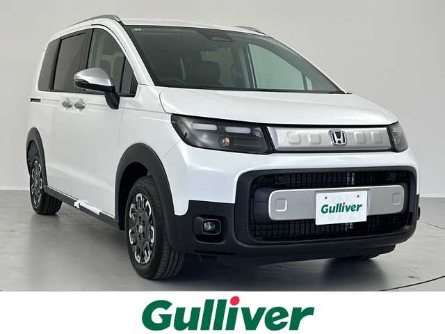 ホンダ フリード ハイブリット e:HEV クロスター 福島県 2025(令7)年 0.1千km プラチナホワイトパール /禁煙車//4WD//Honda SENSING/・衝突軽減ブレーキ/・路外逸脱抑制機能/・アダプティブクルーズコントロール/・車線維持支援システム/・オートハイビーム//メーカーOPナビ/・BT.USB.スマホ連携/・フルセグTV//バックカメラ//両側パワースライドドア//ハーフレザーシート/・前席シートヒーター//LEDヘッドライト//LEDフォグライト//プッシュスタート//スマートキー×2//ステアリングスイッチ//純正15インチAW//ロールサンシェード//ワイパーデアイサー