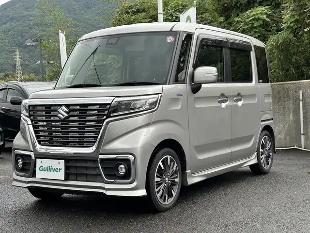 スズキ スペーシア カスタム HYBRID XS 鹿児島県 2020(令2)年 2.1万km スチールシルバーM 社外ディスプレイオーディオ(FM/AM/CD/DVD/BT)/プッシュスタート/両側パワスラ/バックカメラ/アイドリングストップ/ハーフレザーシート/D席シートヒーター/純正フロアマット/純正アルミホイール/オートライト/ABS/ESP/DSBS/レーンキープアシスト/後方コーナーセンサー/イモビライザーシステム/スマートキー/取扱説明書/保証書