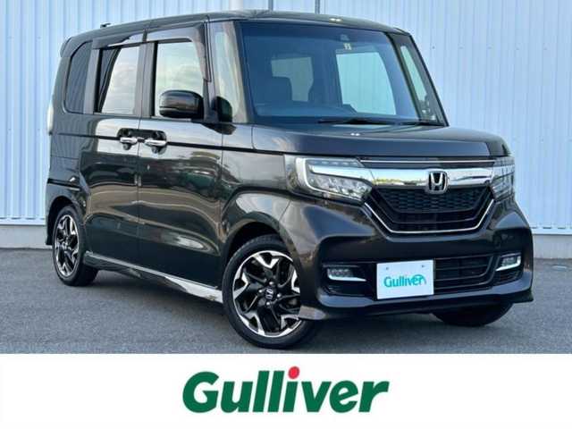 ホンダ Ｎ ＢＯＸ カスタム G L ターボ ホンダセンシング 愛媛県 2018(平30)年 4.4万km ゴールド 両側パワースライドドア/バックカメラ/LEDオートライト/クルーズコントロール　追従機能付き/純正１５インチアルミホイール/レーンキープアシスト/アイドリングストップ/カーテンエアバック/純正フロアマット/ハーフレザーシート/エンジンスタートボタン/CDチェンジャー/AAC/ABS/USB入力端子/ETC/パワーステアリング/パワーウィンドウ/スマートキー