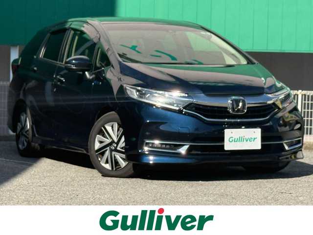 ホンダ シャトル ハイブリッド X ホンダセンシング 千葉県 2021(令3)年 5万km ミッドナイトブルービームM 純正8インチインターナビ（（VXM-217VFEi）/フルセグ/バックカメラ/前後ドラレコ/ETC/前席シートヒーター/パドルシフト/ハーフレザー/ホンダセンシング/レーダークルーズコントロール/LEDライト