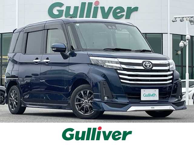 トヨタ ルーミー カスタムG 佐賀県 2021(令3)年 1万km レーザーブルークリスタルシャイン スマートアシスト３/　レーダークルーズコントロール/　衝突回避支援ブレーキ/　車線逸脱警報/　誤発進抑制制御/　先行車発進お知らせ機能/　標識認識機能/　ふらつき警報/モデリスタエアロ/純正9型ディスプレイオーディオ/TV Bluetooth USB/全方位カメラ/前後ドライブレコーダー/両側パワースライドドア/電子パーキング/ブレーキホールド機能/D＋N席シートヒーター/後席用サイドサンシェード/ISOFIX/ステアリングリモコン/純正LEDヘッドライト/フォグライト/オートハイビーム/プッシュスタート/スマートキー