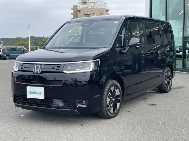 ホンダ ステップワゴン eHEV エアー EX 東京都 2025(令7)年 0.1千km クリスタルブラックパール 純正11.4インチナビ/純正15.6インチ後席モニター/フルセグ/バックカメラ/両側パワースライドドア/パワーバックドア/シートヒーター/Honda SENSING/衝突軽減ブレーキ/レーンキープアシスト/アダプティブクルーズコントロール/オートハイビーム/ブラインドスポットモニター/LEDヘッドライト/スマートキー