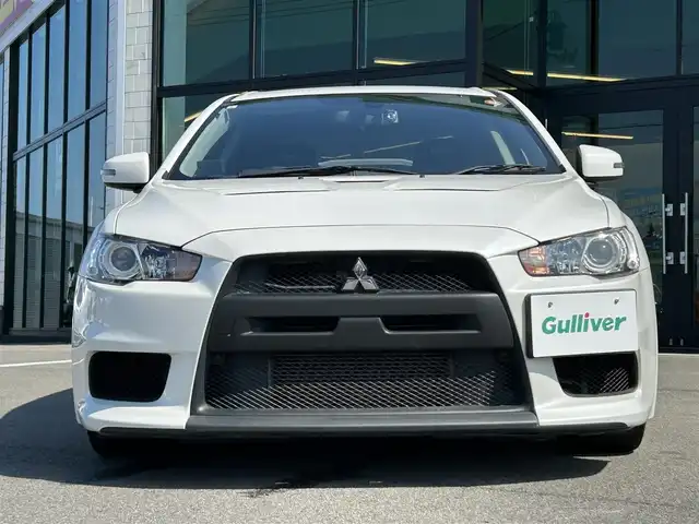 三菱 ランサー GSR エボリューションⅩ 愛媛県 2015(平27)年 14.2万km シルキーホワイト KENWOOD7型ナビ(AM/FM/フルセグTV)/RECARO製フルバケットシート/ENKEI製18インチ鋳造アルミホイール/ツインクラッチSST/パドルシフト/TEIN車高調/brembo製ブレーキキャリパー/ツイステッドウイングタイプ大型リヤスポイラー/本革巻3本スポークステアリングホイール/S-AWC/ドライブレコーダー/ASSURAレーダー探知機(AR-252GA) /BRIDGESTONEタイヤ空気圧モニタリングシステム/電格ミラー/ISOFIX/オートライト/現状サマー(純正AW)(245/40/R18)/YOKOHAMA ADVAN NEOVA AD09