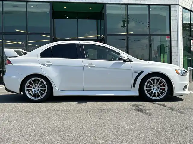 三菱 ランサー GSR エボリューションⅩ 愛媛県 2015(平27)年 14.2万km シルキーホワイト KENWOOD7型ナビ(AM/FM/フルセグTV)/RECARO製フルバケットシート/ENKEI製18インチ鋳造アルミホイール/ツインクラッチSST/パドルシフト/TEIN車高調/brembo製ブレーキキャリパー/ツイステッドウイングタイプ大型リヤスポイラー/本革巻3本スポークステアリングホイール/S-AWC/ドライブレコーダー/ASSURAレーダー探知機(AR-252GA) /BRIDGESTONEタイヤ空気圧モニタリングシステム/電格ミラー/ISOFIX/オートライト/現状サマー(純正AW)(245/40/R18)/YOKOHAMA ADVAN NEOVA AD09