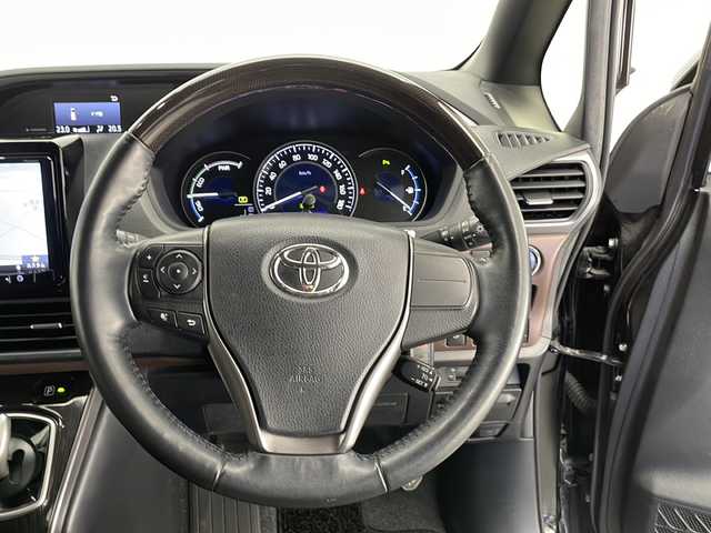 トヨタ エスクァイア ハイブリッド Gi プレミアムパッケージ 熊本県 2020(令2)年 6.6万km ブラック 社外９型ナビ/・AM/FM/CD/DVD/TV/BT/・フルセグTV/トヨタセーフティーセンス/・プリクラッシュセーフティー/・レーンディパーチャーアラート/・オートマチックハイビーム/バックカメラ/両側パワースライドドア/LEDヘッドライト/アイドリングストップ/純正フロアマット/ドライブレコーダー/社外フリップダウンモニター/純正エンジンスターター/ハーフレザーシート/・前席シートヒーター/ステアリングヒーター/コンビステアリング/電動格納ミラー/・ウィンカーミラー