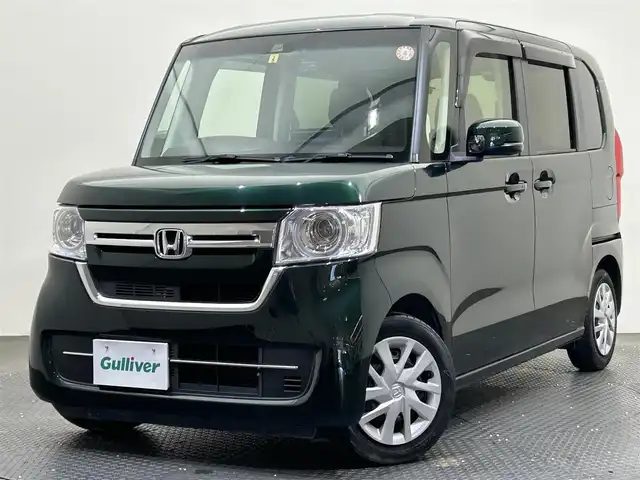 ホンダ Ｎ ＢＯＸ L 愛媛県 2023(令5)年 2.9万km ブリティッシュグリーンP ・９型ナビ/（フルセグＴＶ・ＢＴ・ＣＤ・ＤＶＤ・ＦＭ・ＡＭ・ＳＤ・ａｐｐｌｅ　ｃａｒｐｌａｙ・ａｎｄｒｏｉｄ　ａｕｔｏ・ＵＳＢ）/・バックカメラ　/・１１．６型後席モニター　/・ＥＴＣ　/・前後ドラレコ　/・レーダークルーズコントロール/・片側パワースライドドア/・衝突軽減ブレーキ/・レーンキープアシスト/・DN席シートヒーター/・スペアキー