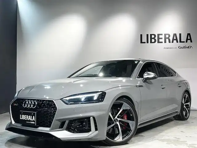 アウディ ＲＳ５ スポーツバック 道央・札幌 2019(令1)年 3.6万km グレー アシスタンスパッケージ/・パークアシスト/・サラウンドビューカメラ/RSスポーツエグゾーストシステム/マトリクスLEDヘッドライト/Sスポーツシート(フロント)/ファインナッパレザー/電動調整機能(フロント)/シートヒーター(全席)/MMIナビゲーション/バーチャルコックピット/TVチューナー/Bang&Olufsen3Dアドバンストサウンドシステム/マルチカラーアンビエントライティング/オートマチックテールゲート/ドライブセレクト/レッドキャリパー/アダプティブクルーズコントロール/アウディアクティブレーンアシスト/アウディサイドアシスト/アウディパーキングシステム/アウディプレセンスベーシック/アウディプレセンスリヤ/アウディプレセンスシティ/パドルシフト/プッシュスタート/スマートキー/スペアキー/ETC2.0