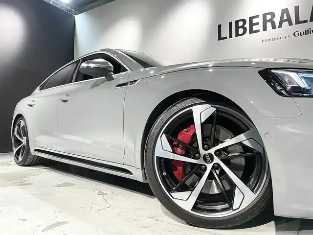 アウディ ＲＳ５ スポーツバック 道央・札幌 2019(令1)年 3.6万km グレー アシスタンスパッケージ/・パークアシスト/・サラウンドビューカメラ/RSスポーツエグゾーストシステム/マトリクスLEDヘッドライト/Sスポーツシート(フロント)/ファインナッパレザー/電動調整機能(フロント)/シートヒーター(全席)/MMIナビゲーション/バーチャルコックピット/TVチューナー/Bang&Olufsen3Dアドバンストサウンドシステム/マルチカラーアンビエントライティング/オートマチックテールゲート/ドライブセレクト/レッドキャリパー/アダプティブクルーズコントロール/アウディアクティブレーンアシスト/アウディサイドアシスト/アウディパーキングシステム/アウディプレセンスベーシック/アウディプレセンスリヤ/アウディプレセンスシティ/パドルシフト/プッシュスタート/スマートキー/スペアキー/ETC2.0