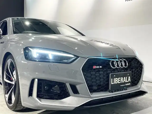 アウディ ＲＳ５ スポーツバック 道央・札幌 2019(令1)年 3.6万km グレー アシスタンスパッケージ/・パークアシスト/・サラウンドビューカメラ/RSスポーツエグゾーストシステム/マトリクスLEDヘッドライト/Sスポーツシート(フロント)/ファインナッパレザー/電動調整機能(フロント)/シートヒーター(全席)/MMIナビゲーション/バーチャルコックピット/TVチューナー/Bang&Olufsen3Dアドバンストサウンドシステム/マルチカラーアンビエントライティング/オートマチックテールゲート/ドライブセレクト/レッドキャリパー/アダプティブクルーズコントロール/アウディアクティブレーンアシスト/アウディサイドアシスト/アウディパーキングシステム/アウディプレセンスベーシック/アウディプレセンスリヤ/アウディプレセンスシティ/パドルシフト/プッシュスタート/スマートキー/スペアキー/ETC2.0