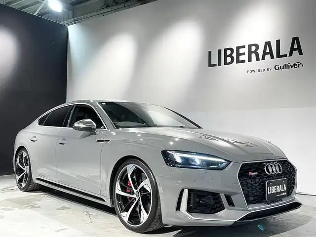 アウディ ＲＳ５ スポーツバック 道央・札幌 2019(令1)年 3.6万km グレー アシスタンスパッケージ/・パークアシスト/・サラウンドビューカメラ/RSスポーツエグゾーストシステム/マトリクスLEDヘッドライト/Sスポーツシート(フロント)/ファインナッパレザー/電動調整機能(フロント)/シートヒーター(全席)/MMIナビゲーション/バーチャルコックピット/TVチューナー/Bang&Olufsen3Dアドバンストサウンドシステム/マルチカラーアンビエントライティング/オートマチックテールゲート/ドライブセレクト/レッドキャリパー/アダプティブクルーズコントロール/アウディアクティブレーンアシスト/アウディサイドアシスト/アウディパーキングシステム/アウディプレセンスベーシック/アウディプレセンスリヤ/アウディプレセンスシティ/パドルシフト/プッシュスタート/スマートキー/スペアキー/ETC2.0