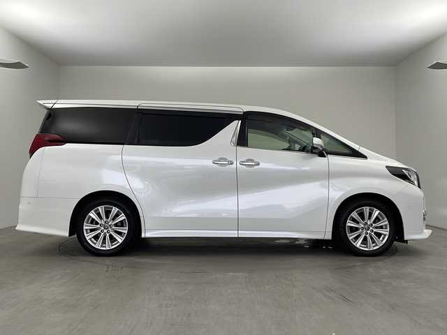 トヨタ アルファード S Cパッケージ 兵庫県 2015(平27)年 7.3万km ホワイトパールクリスタルシャイン ・純正ナビ/SD/USB/BT/TV/・JBLプレミアムサウンド/・バックカメラ/・ビルトインETC/・両側パワースライドドア/・パワーバックドア/・プリクラッシュセーフティ/・レーダークルーズコントロール/・インテリジェントクリアランスソナー/・インテリジェントパーキングアシスト/・電子パーキング/・オートホールド/・ハーフレザーシート/・前席パワーシート/・運転席メモリーシート/・2列目オットマン/・ステアリングヒーター/・革巻きステアリング/・MTモード付AT/・nanoe/・デュアルオートエアコン/・防眩ミラー/・純正フロアマット/・スマートキー/・スペアキー