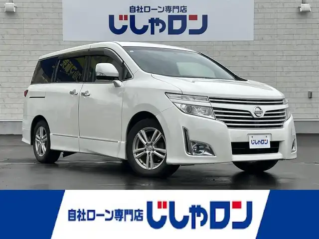 日産 エルグランド 250ハイウェイスター 道北・旭川 2013(平25)年 10.8万km ブリリアントホワイトパール (株)IDOMが運営する【じしゃロン旭川店】の自社ローン専用車両になります。こちらは現金またはオートローンご利用時の価格です。自社ローンご希望の方は別途その旨お申付け下さい・/　/・純正ナビ(CD/DVD/BT/SD/フルセグ)/・ビルトインETC/・両席パワースライドドア/・横滑り防止装置/・社外フリップダウンモニター/・電動格納ウィンカーミラー/・プッシュスタート/・スマートキー/・フォグランプ/・取扱説明書