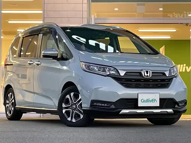 ホンダ フリード ハイブリット クロスター 兵庫県 2023(令5)年 1.2万km フィヨルドミストパール 純正9インチプレミアムインターナビ/Bluetooth/フルセグ/HDMI/アップルカープレイ/CD/DVD/純正15.6インチフリップダウン/ETC/両側パワースライド/ハーフレザーシート/シートヒーター