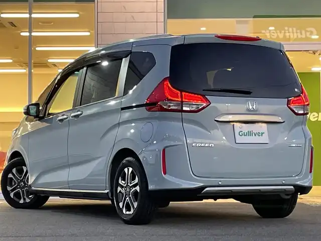 ホンダ フリード ハイブリット クロスター 兵庫県 2023(令5)年 1.2万km フィヨルドミストパール 純正9インチプレミアムインターナビ/Bluetooth/フルセグ/HDMI/アップルカープレイ/CD/DVD/純正15.6インチフリップダウン/ETC/両側パワースライド/ハーフレザーシート/シートヒーター